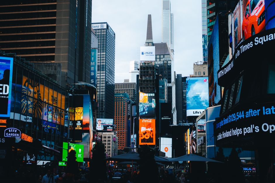 Illuminated Times Square and the New York skyline in New York City.