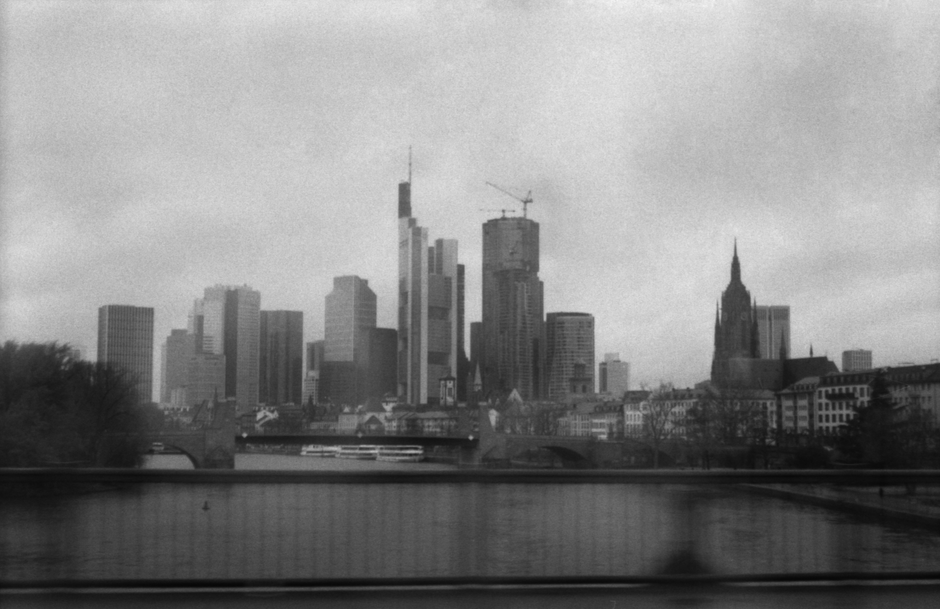 Financial-district skyline representing the capital-market network that must absorb new equity supply.