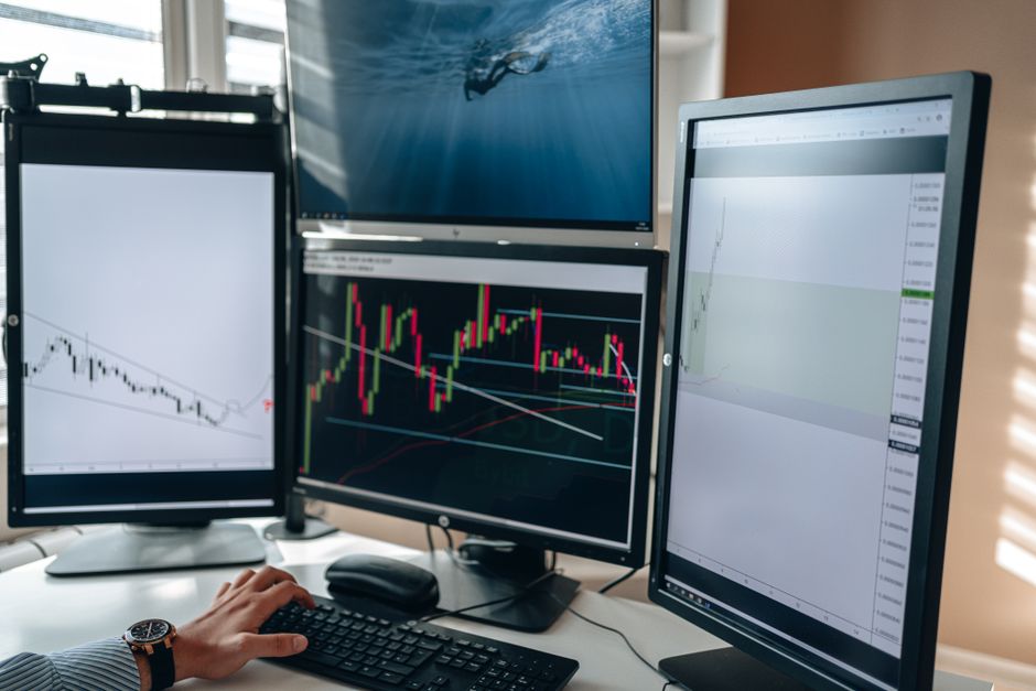 Financial trading workstation displaying charts and market data