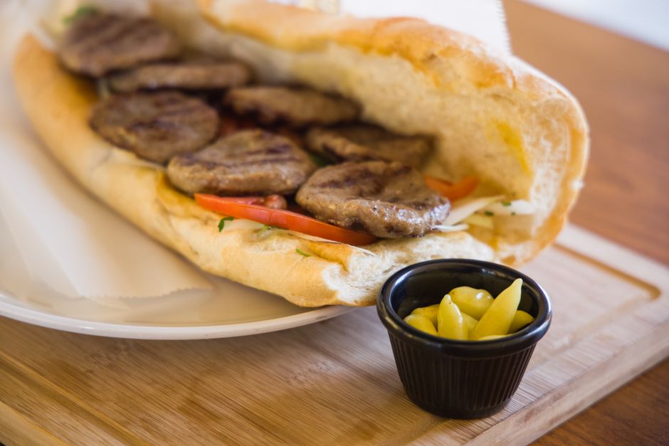 Grilled sandwich served on a ceramic plate