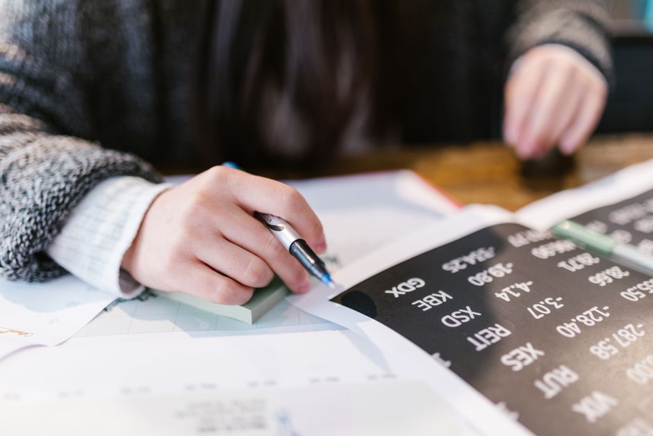 An analyst reviews financial documents related to capital-market issuance.