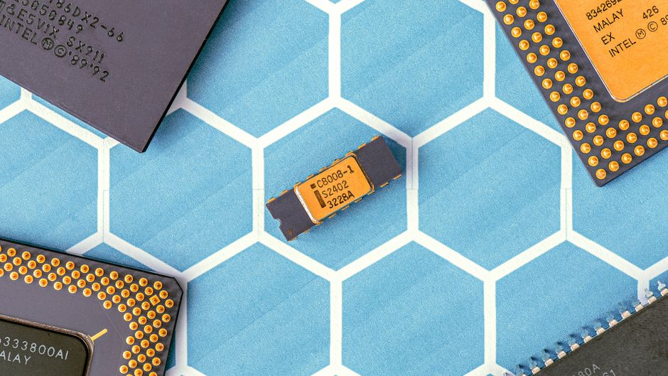 Close-up of microprocessor chips on a blue patterned surface, representing semiconductor supply chains targeted by the new US polysilicon tariff.