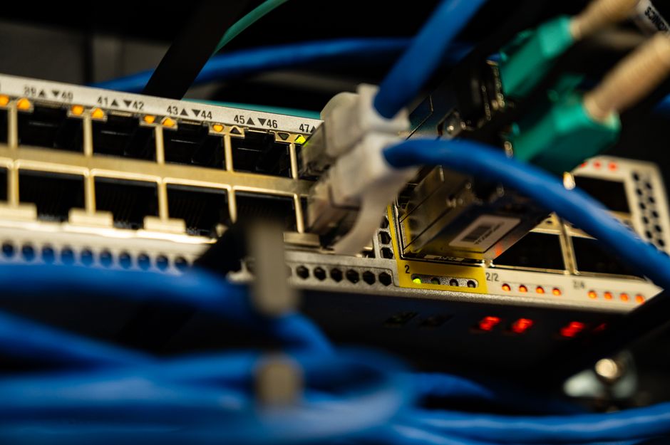 Network cables connect high-performance computing infrastructure used to deliver cloud and AI workloads.