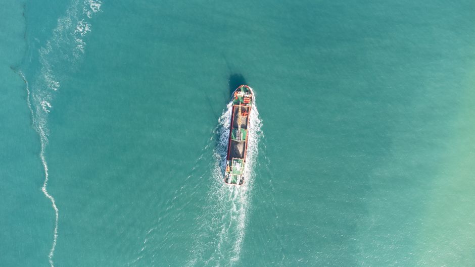 A container ship crossing open water on a strategic freight route