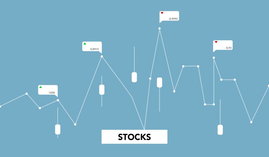 Decorative cardboard cutouts showing stock market growth diagrams on a blue background