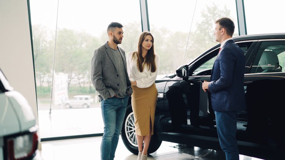 An auto dealership conversation represents the consumer demand and financing sensitivity facing discretionary businesses.