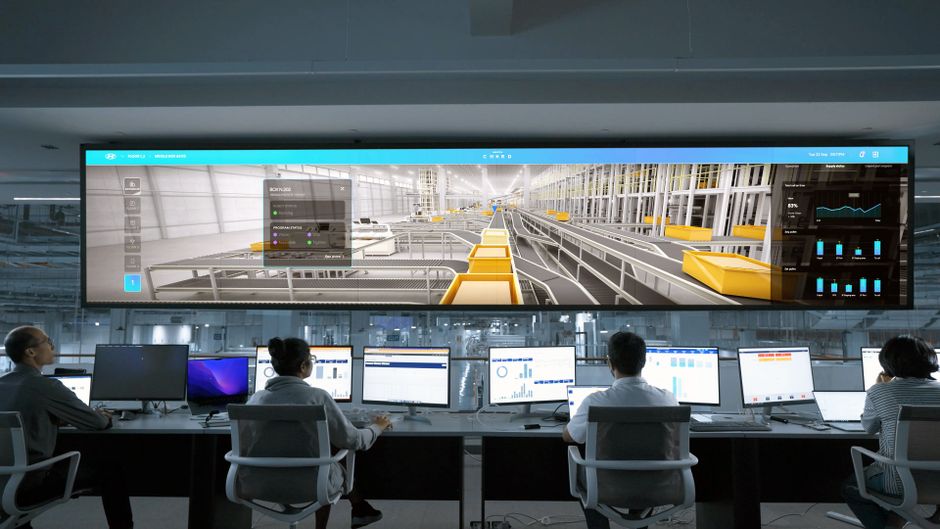Operations team monitoring financial market systems and digital displays