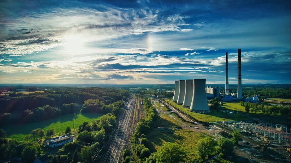 A power plant represents the electricity infrastructure required for the AI and cloud build-out amid rising policy and supply-chain constraints.