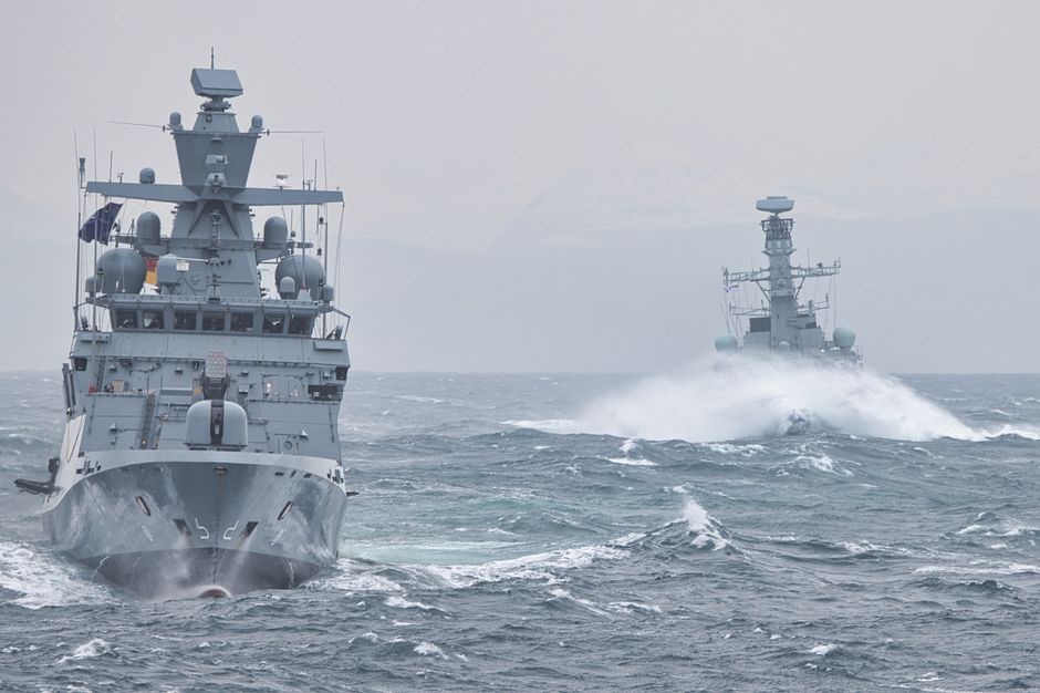 Naval warships steaming through open ocean waters under overcast skies, illustrating maritime blockade operations.