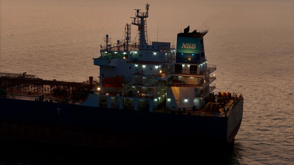 A cargo vessel continues along a maritime route as geopolitical risk raises the cost of global energy transport.