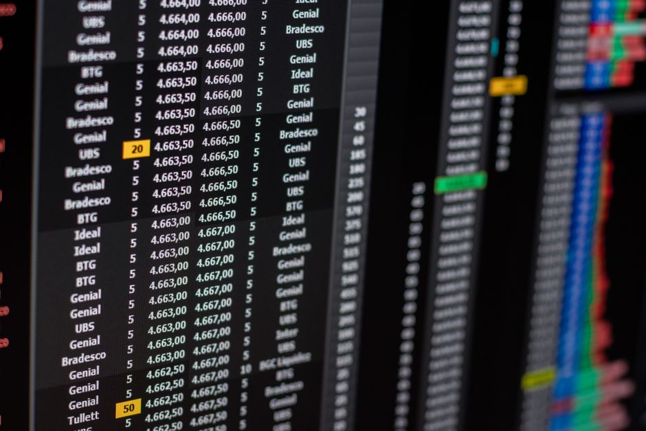 Financial market data displayed on screens, illustrating the trading and liquidity environment for new listings.