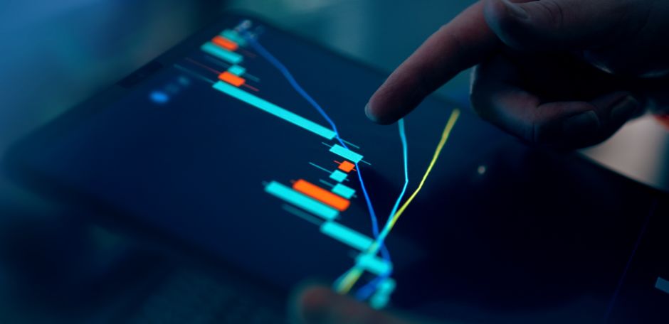 Digital market display showing changing stock prices and trading data