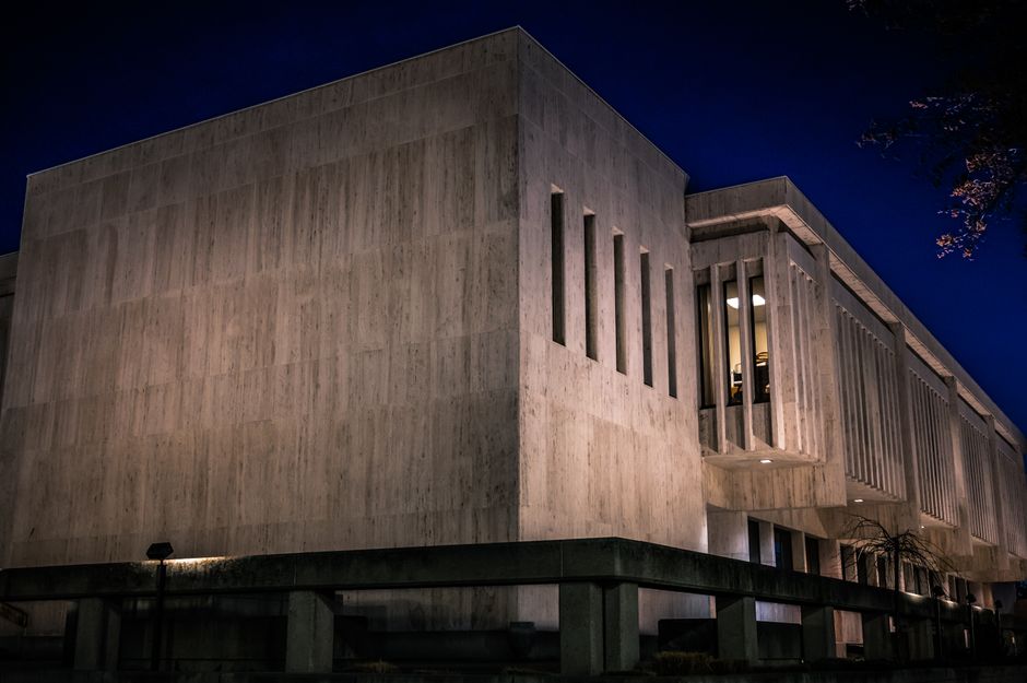 Modern concrete institutional building representing the regulatory framework behind public-company registration and market access.