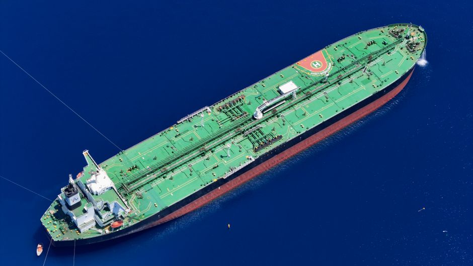Aerial view of a large oil tanker vessel sailing through open ocean waters, illustrating global energy shipping through critical maritime chokepoints like the Strait of Hormuz.