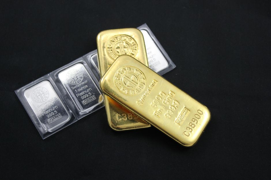 Close-up of stacked gold and platinum bars