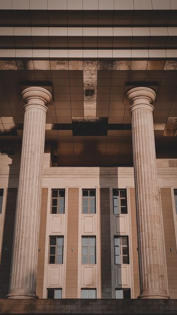 Classical stone columns and facade of a neoclassical government building