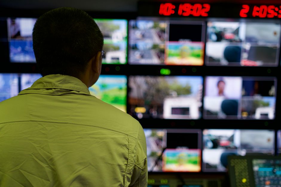 Operations analyst monitoring multiple screens as enterprise software demand becomes a key market signal