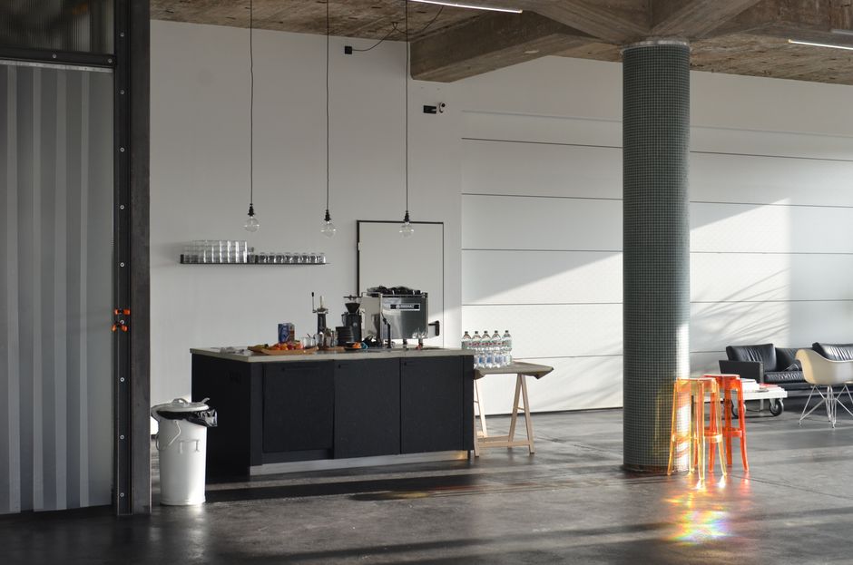 A modern kitchen interior represents the rate-sensitive, physical side of the demand thesis.