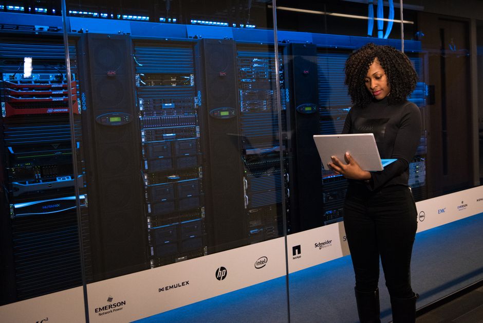A software engineer monitors cloud infrastructure and server operations