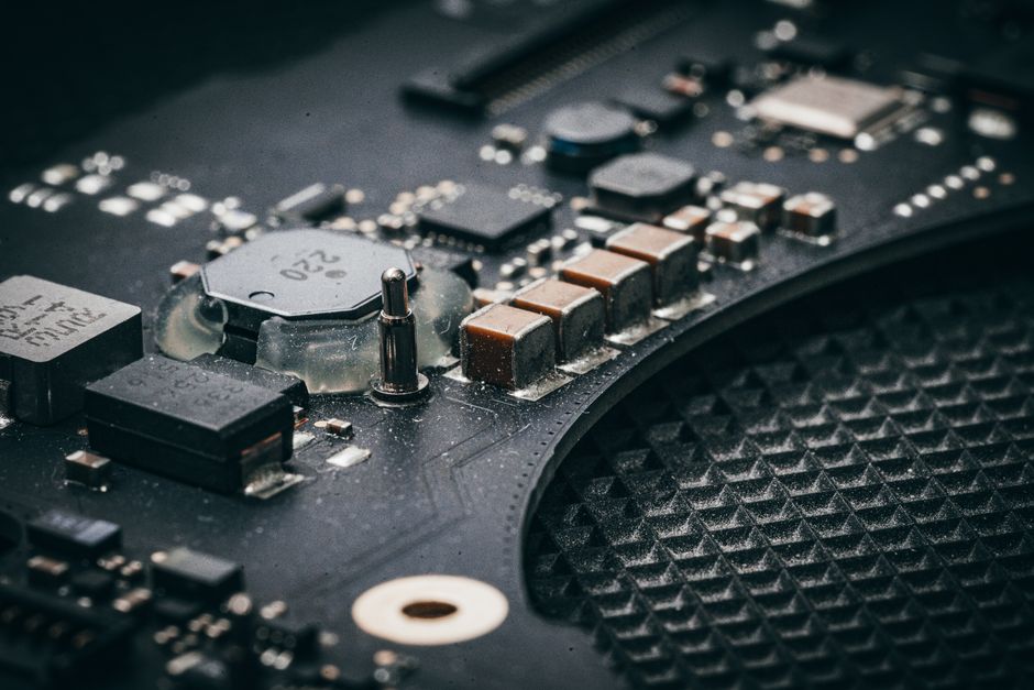 Macro view of an electronic circuit board with dense semiconductor components