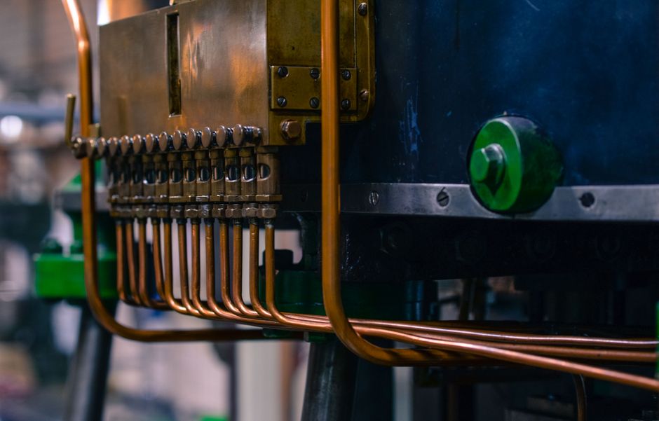 Industrial machinery with copper tubing in a factory setting