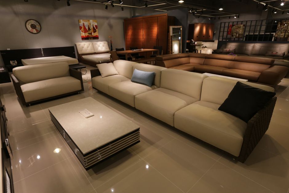 Neutral-toned living room furniture illustrating selective demand in the home category