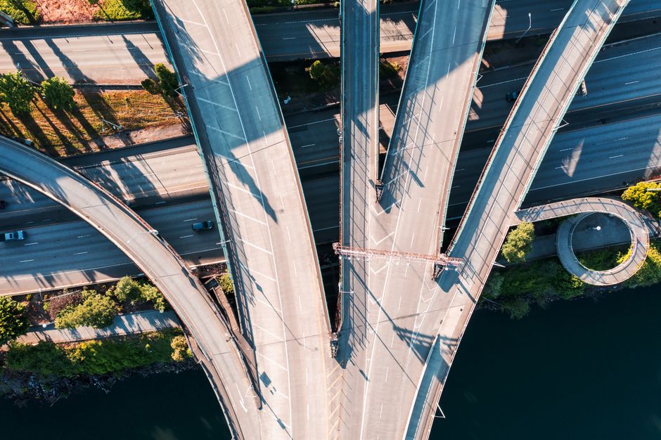 Aerial view of a sprawling highway interchange with multiple curving ramps