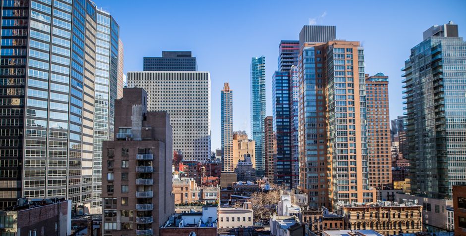 Modern skyscraper cityscape representing the broader rate-sensitive market backdrop