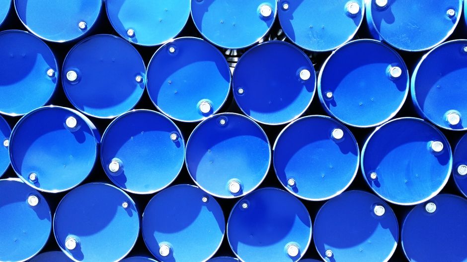 Stacked blue industrial drums forming a geometric pattern