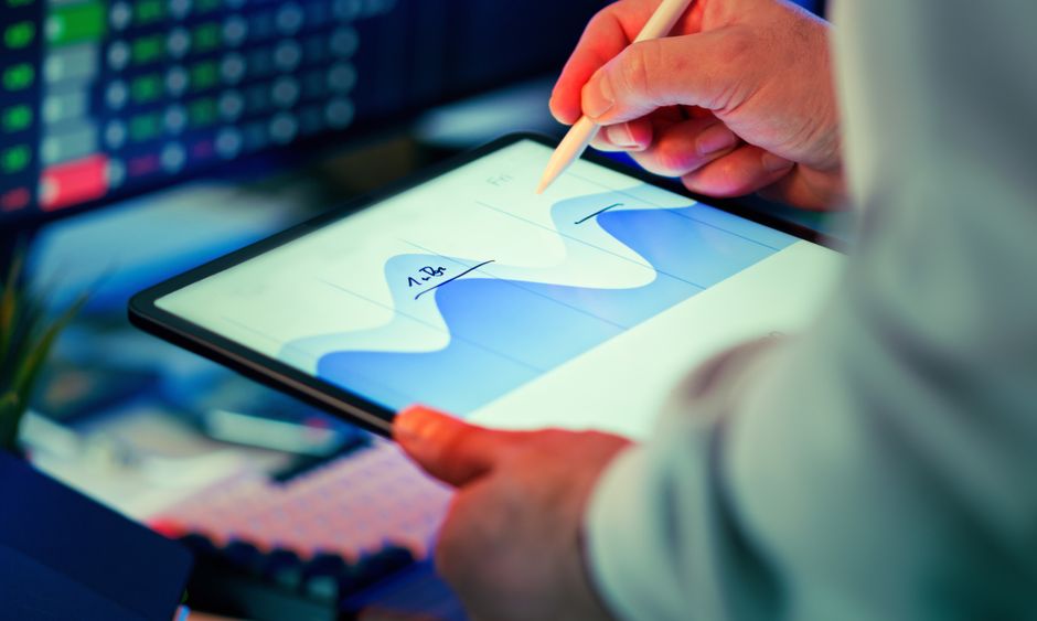 An analyst reviewing data signals tied to the enterprise software demand that remains central to operations