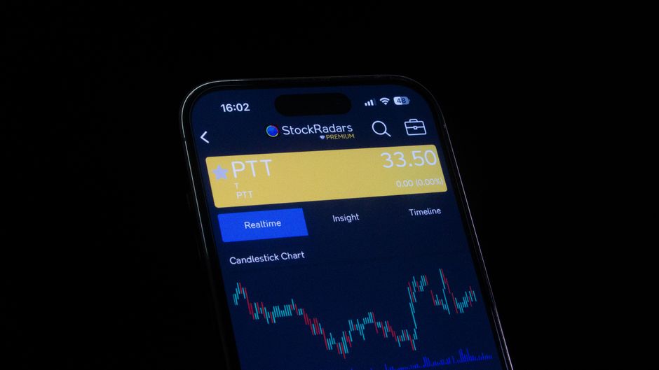 Smartphone displaying a stock-trading interface with market data