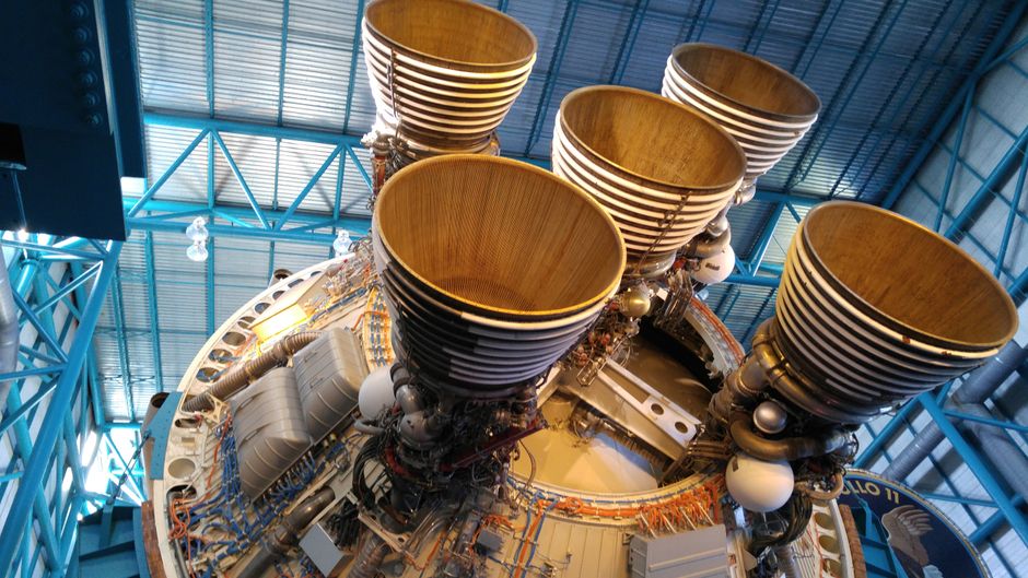 A detailed close-up view of large rocket engine nozzles, showcasing intricate engineering with visible metal components and nozzle geometry.