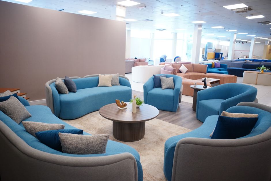 A modern living room illustrates the demand question facing home-furnishings retailers.