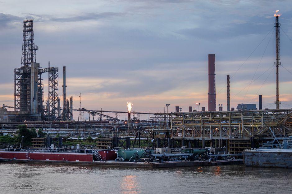 Industrial oil refinery complex at sunset, illustrating the energy infrastructure exposed to the Strait of Hormuz supply crisis.