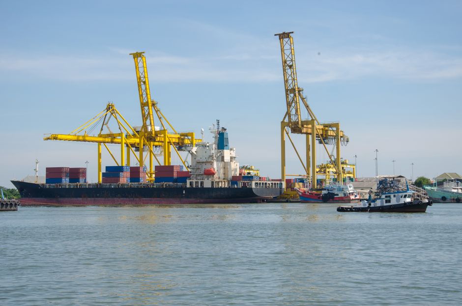 Container ship docked at an industrial port terminal