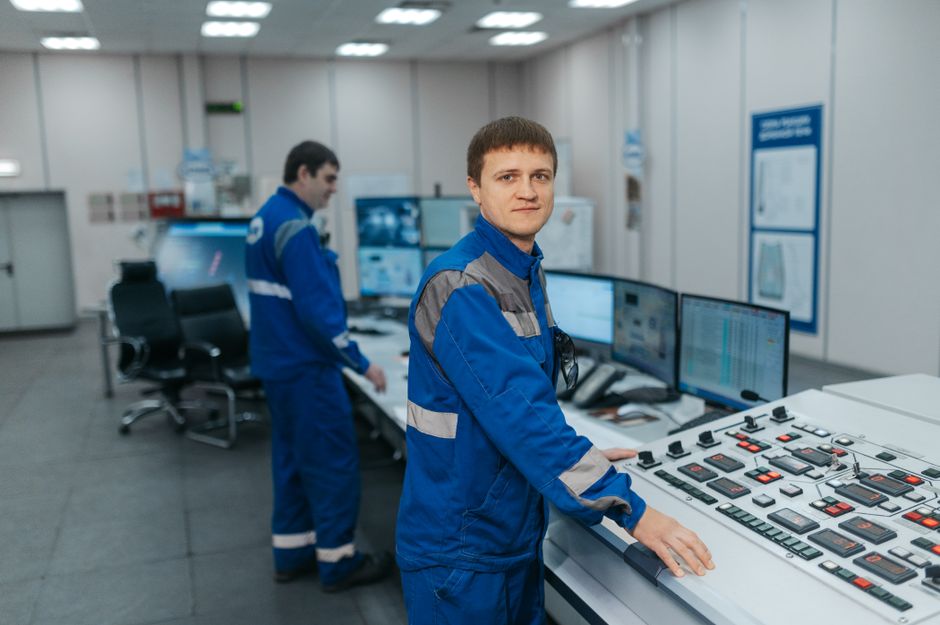Control-room operators monitor complex systems, reflecting the enterprise infrastructure supporting software demand.