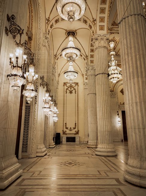 Neoclassical parliament chamber interior with chandeliers