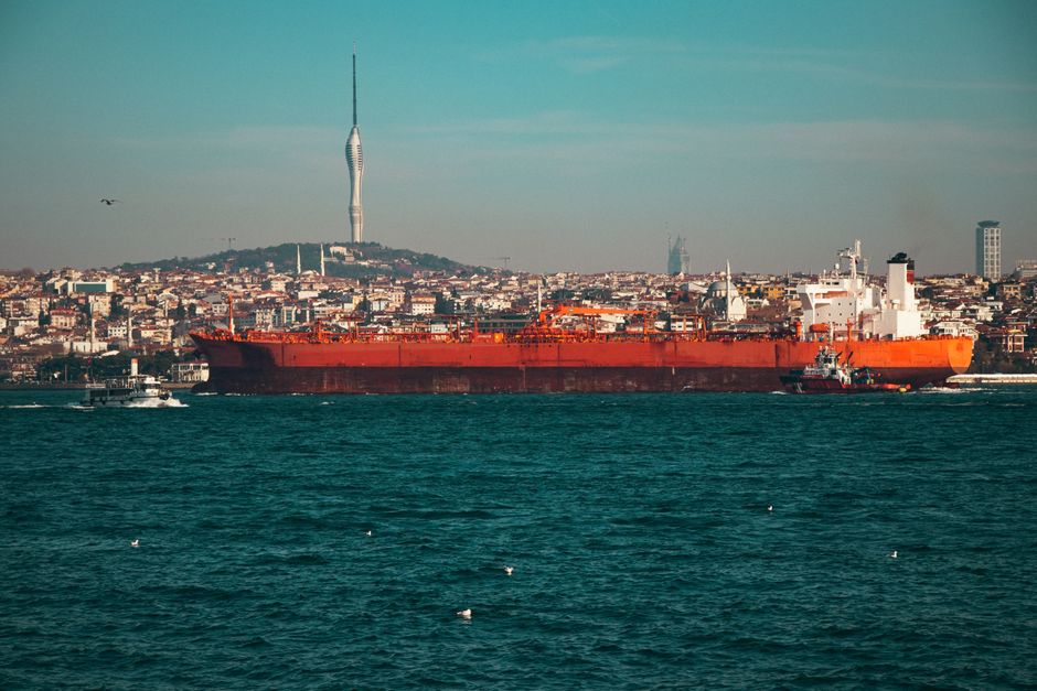 Oil tanker navigating a narrow strait