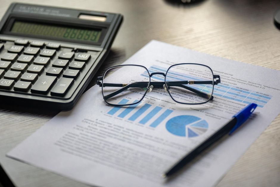 Financial documents and calculations frame how public markets assess new equity supply.