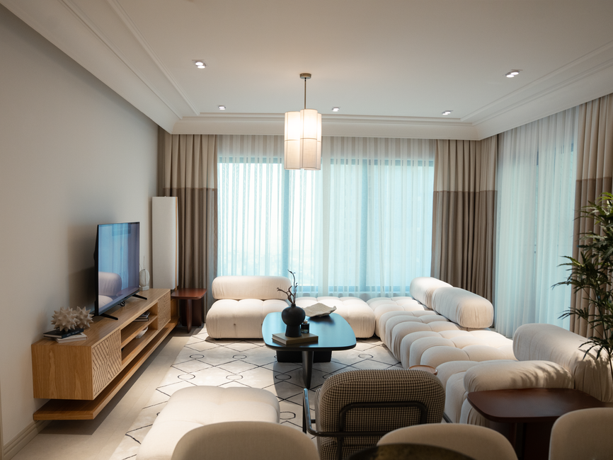 A modern living room represents the housing and discretionary-spending exposure facing home-furnishings companies