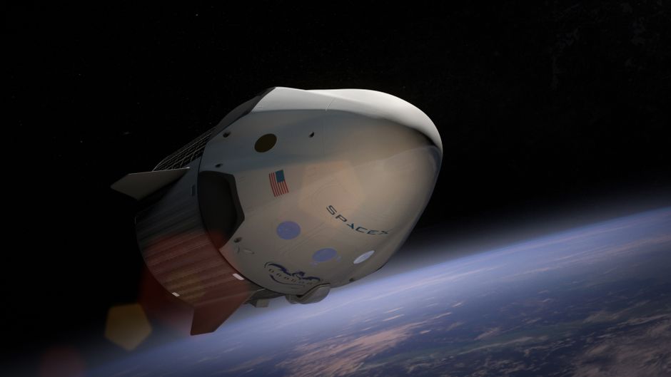 A SpaceX Dragon spacecraft orbiting Earth, captured against the darkness of space