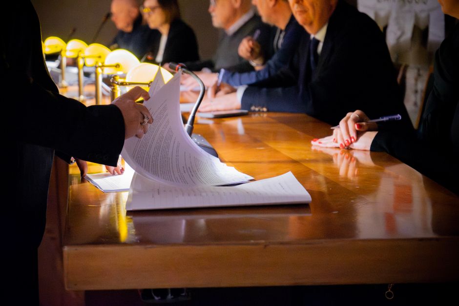 Documents are reviewed during a public-company capital-raising process.