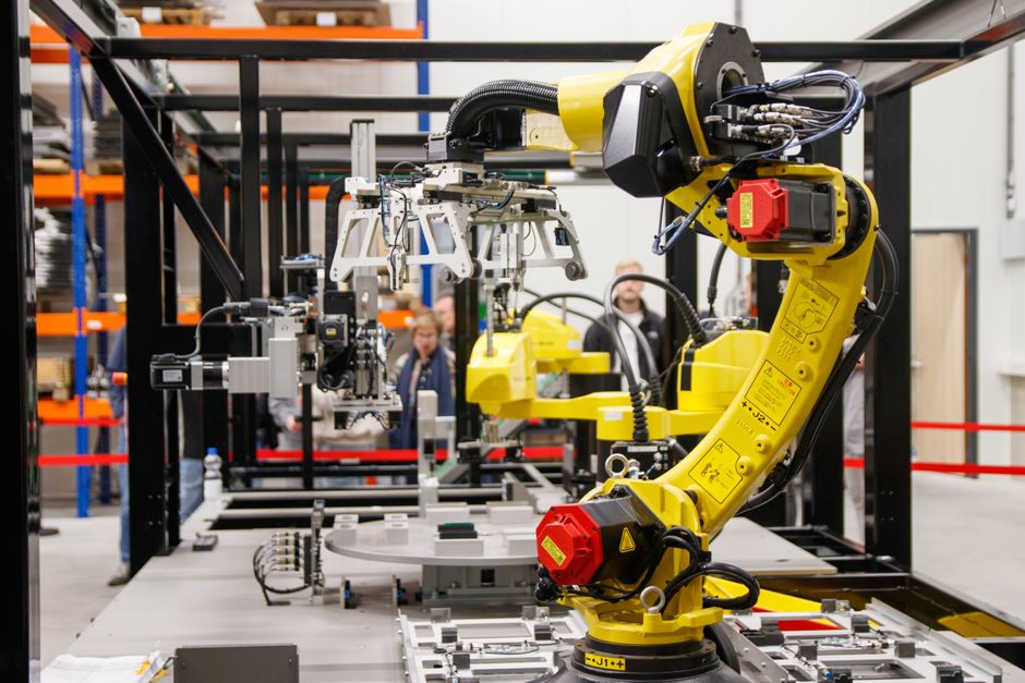 Industrial robotic arm in a manufacturing facility