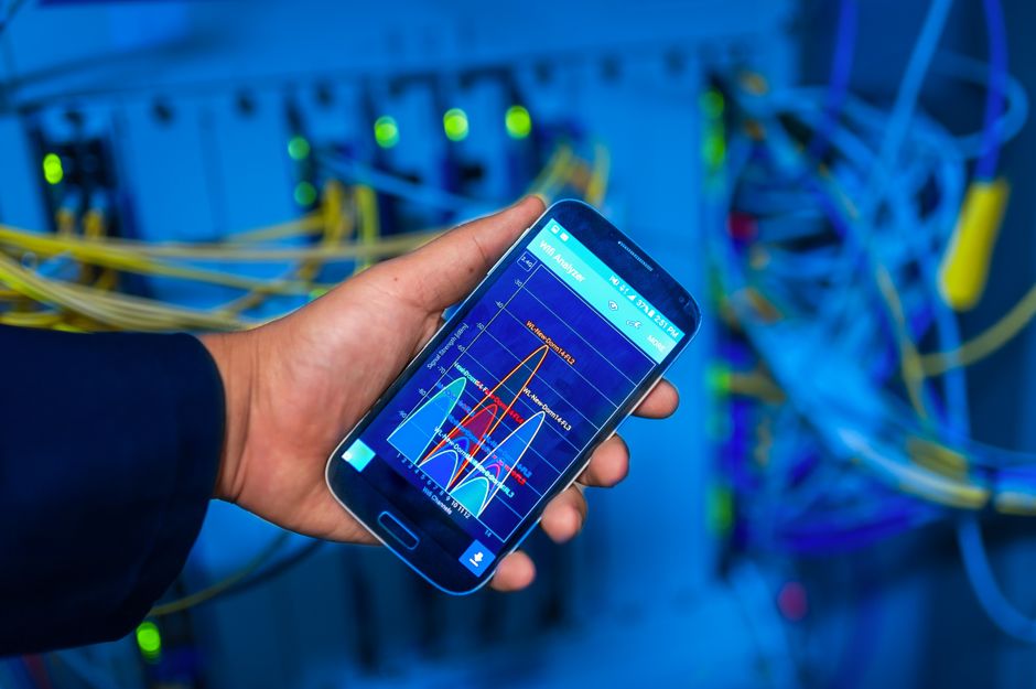 A software engineer monitors cloud infrastructure dashboards, reflecting the measurable usage behind the demand debate.