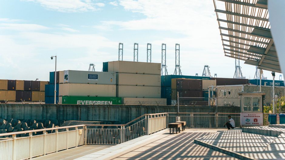 Container terminals and freight networks connect geopolitical shipping risks to physical-goods supply chains.