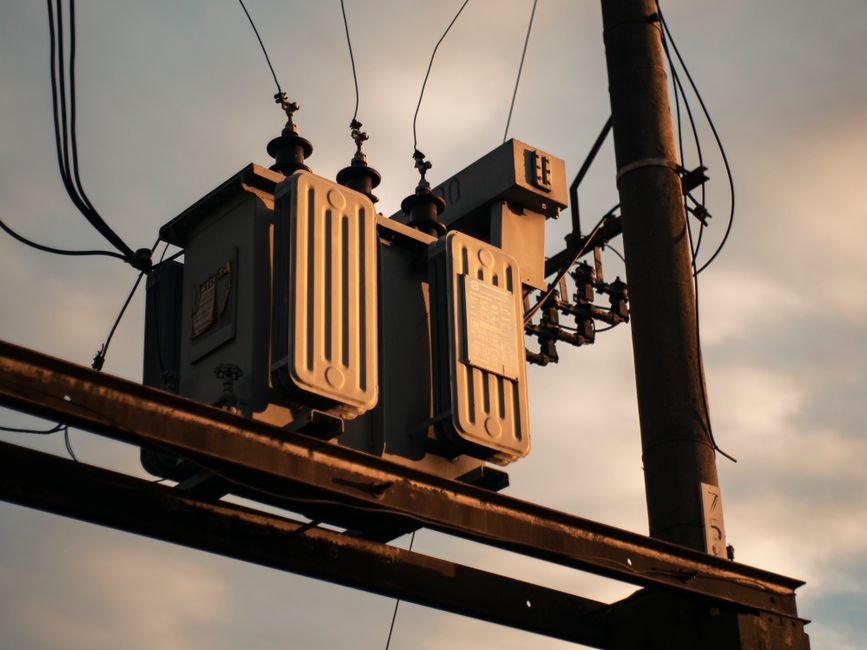 An electrical transformer connected to the power grid
