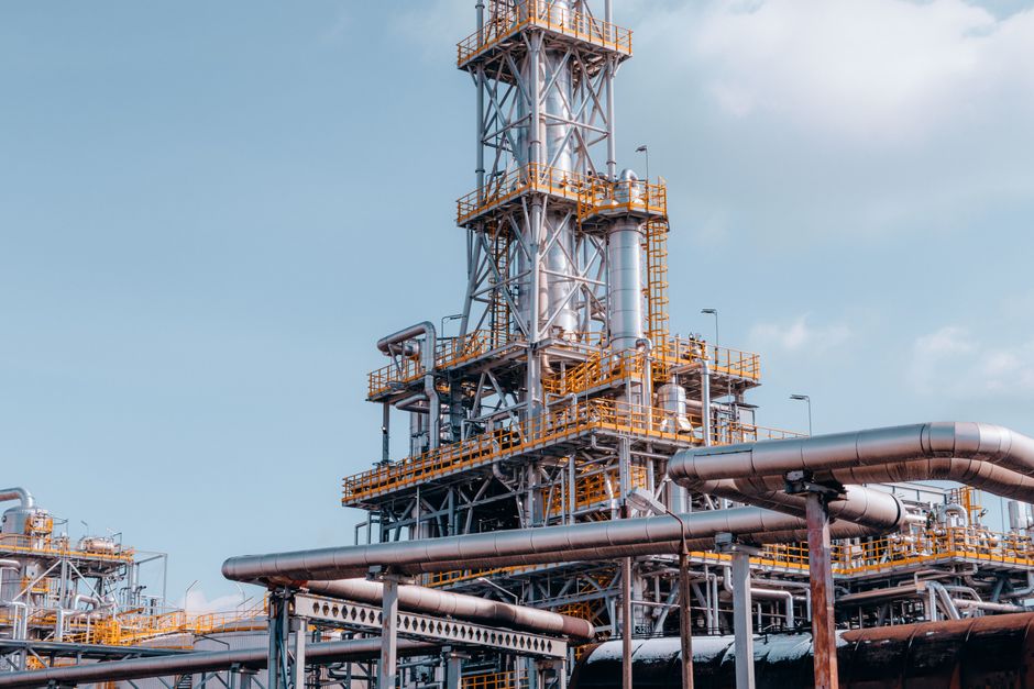 A large oil refinery plant with intricate pipelines.