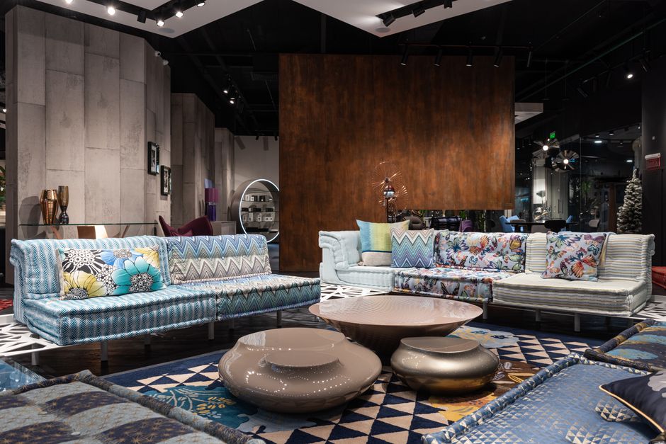 Furniture showroom with sofas and tables arranged for shoppers