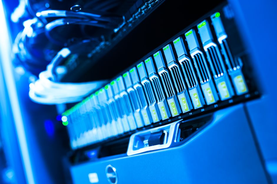 Blue-lit server rack in a data center