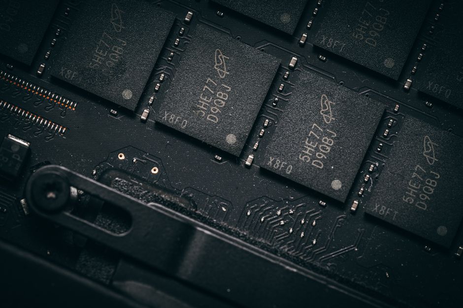 Close-up of microchips on a circuit board, representing semiconductor manufacturing and AI hardware demand